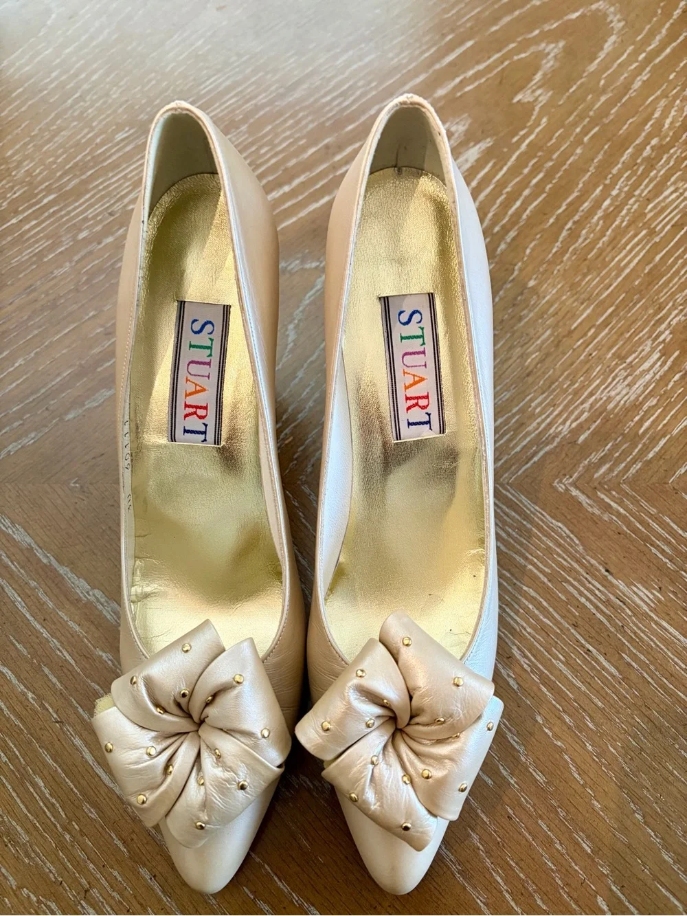 Stuart Weitzman Pearl Bow Pointy Pumps in Light Beige with Gold Studs